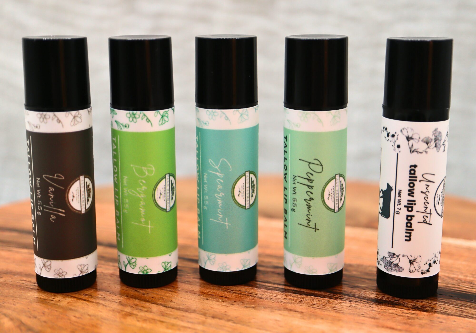 Talo Farmacy lip balms in glass tins, handcrafted with grass-fed tallow, natural moisturizing lip care.